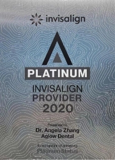 Aglow Plaque displaying 'Invisalign Platinum Provider 2020' certification, awarded to Dr. Angela Zhang of Aglow Dental. The background has a silver metallic texture with wavy lines, and the Invisalign logo is at the top.